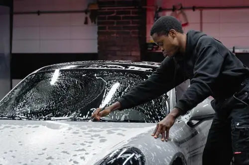Close exterior detailing on a premium vehicle windshield